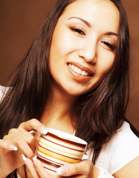 Asian woman drinking coffee or tea