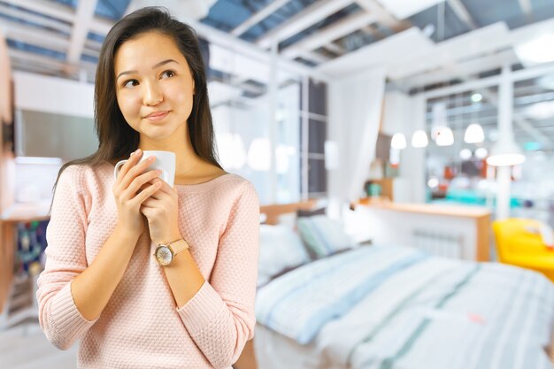 Asian woman enjoy with a cup of coffee