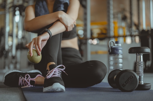 Asian woman exercising in the gym Young woman workout in fitness for her healthy