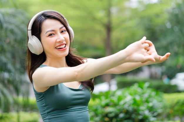 Asian woman exercising at the park