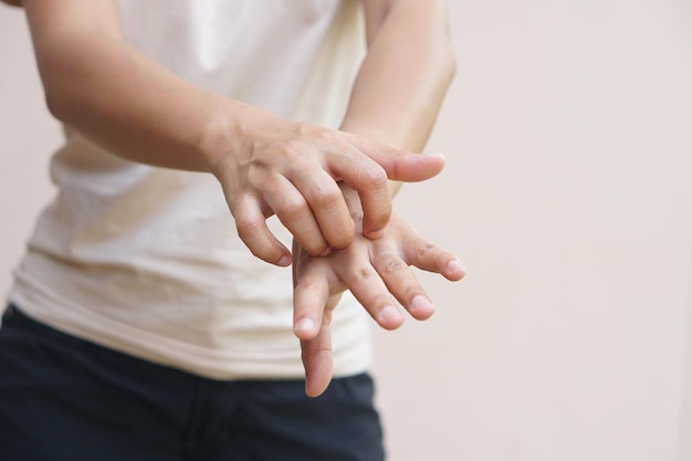 Asian woman having an itchy hand