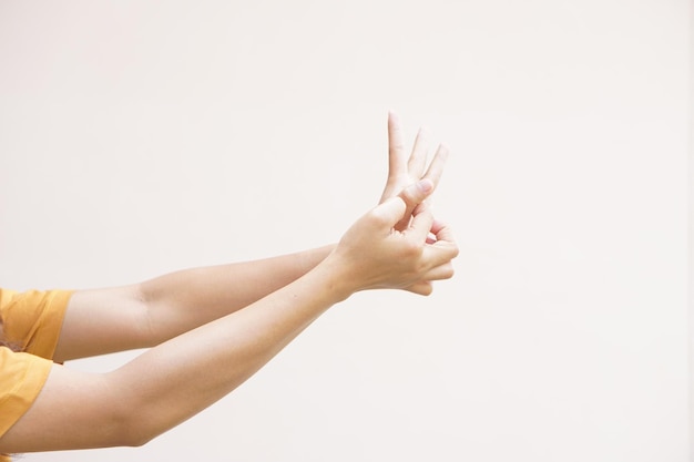 Asian woman having itchy skin on hands