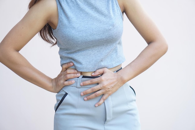 Asian woman having stomach pain from stomach disease not eating on timex9