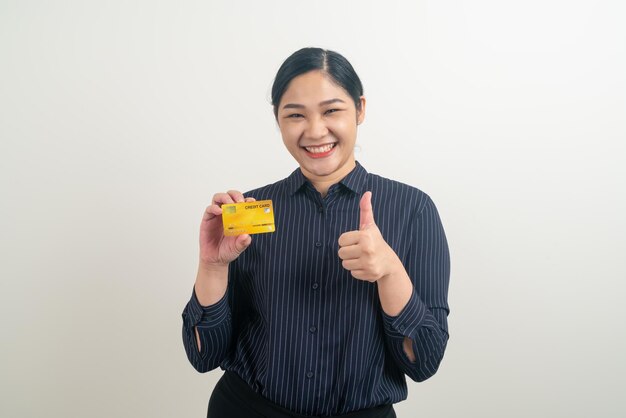 Asian woman holding credit card with white background