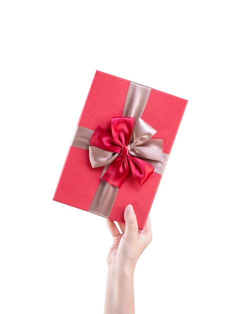 Asian woman holding giving sending a wrapped packaged gift box with tied bowknot isolated on white background clipping path cut out close up