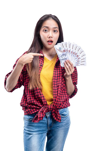 Asian woman holding money isolated over white background