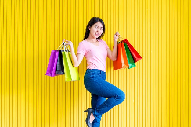 Asian woman holding shopping bags