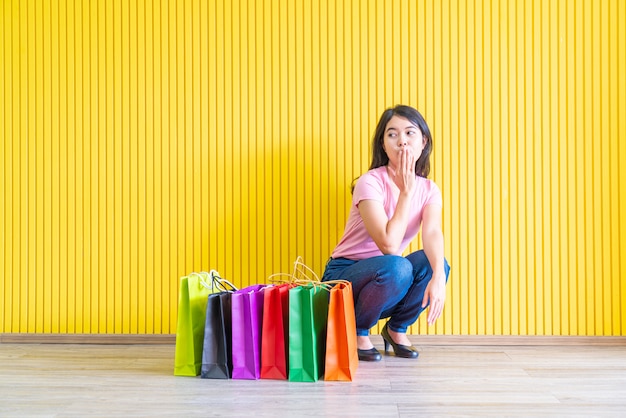 Asian woman holding shopping bags