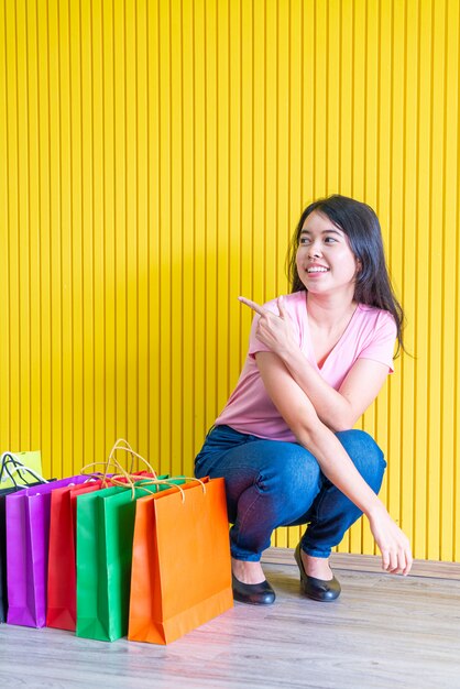 Asian woman holding shopping bags