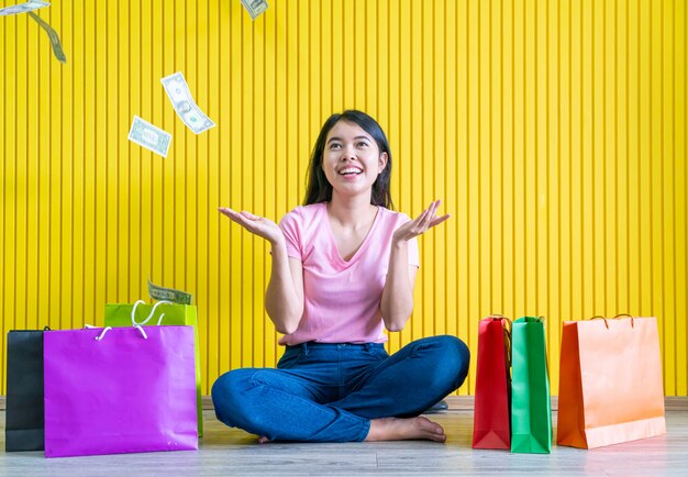 Asian woman holding shopping bags