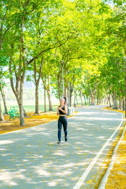 Asian woman jogging and running at park