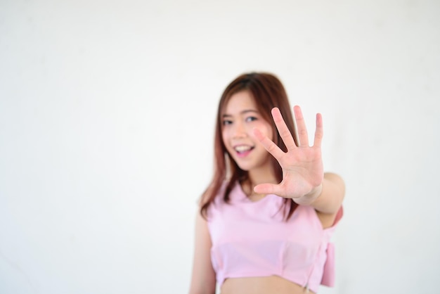 Asian woman make hand stop on white background