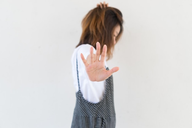 Asian woman make hand stop on white background