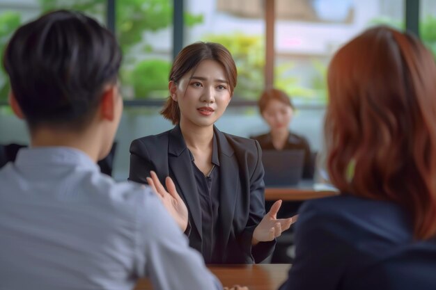 Asian woman manager mentoring her team