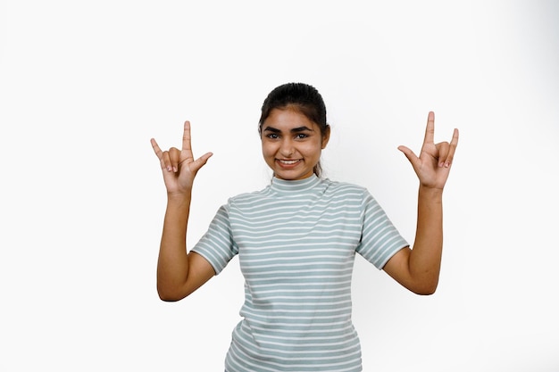 Asian woman pointing up to show information about an offer or ad against a white background