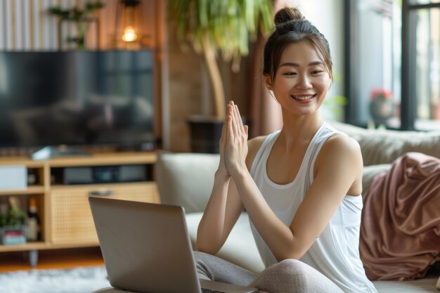 Asian woman practices yoga at home during COVID 19