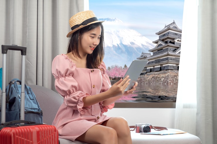 Photo asian woman read and checking travel location on a mobile in her hotel room with curtain