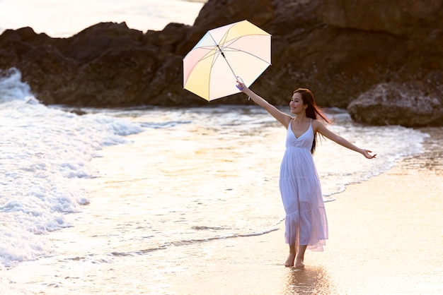 Asian woman relaxing at the beach