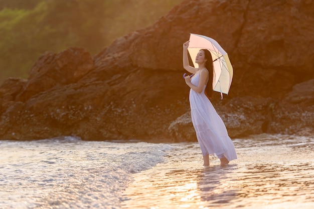 Asian woman relaxing at the beach