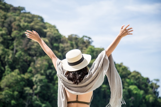 Asian woman relaxing on an island vacation