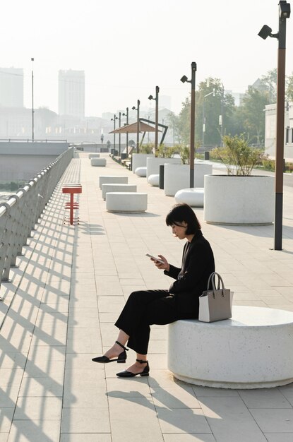 Asian Woman Relaxing Outdoors