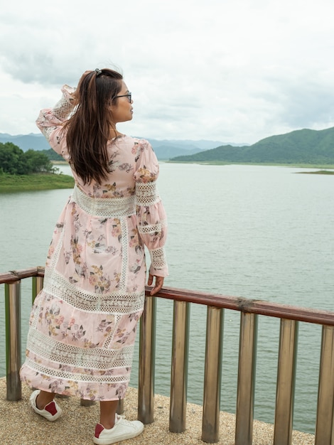 Asian woman next to a reservoir in Thailand