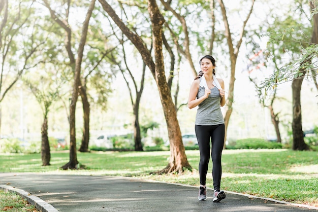 Asian woman running in the park 