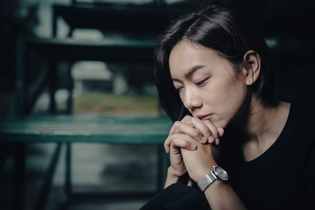 Asian woman sad from loveshe worry because stress from\
boyfriendheartbreak woman concept