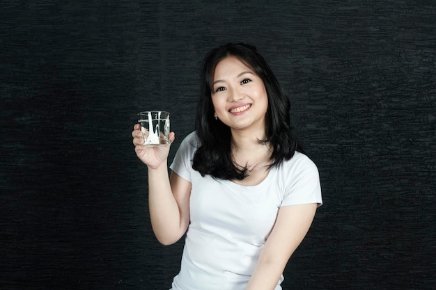 Asian woman smiling drink water