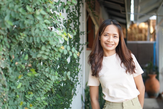 Asian woman smiling happily in a cafe