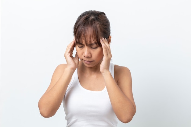 Asian woman suffering from  headache on white background