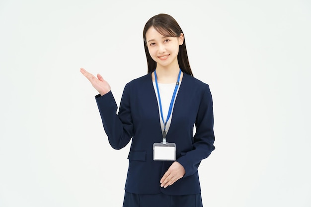 Asian woman in a suit posing as a guide