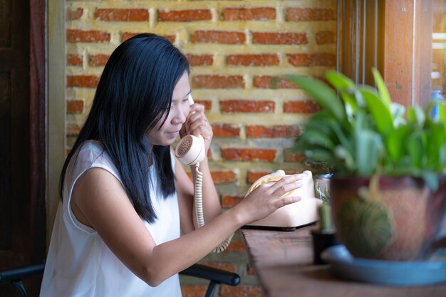 Asian woman talk, vintage telephone 