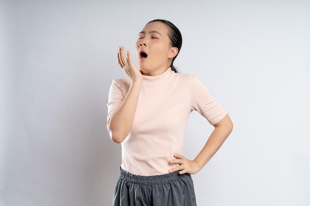 Asian woman tired sleepy and yawning