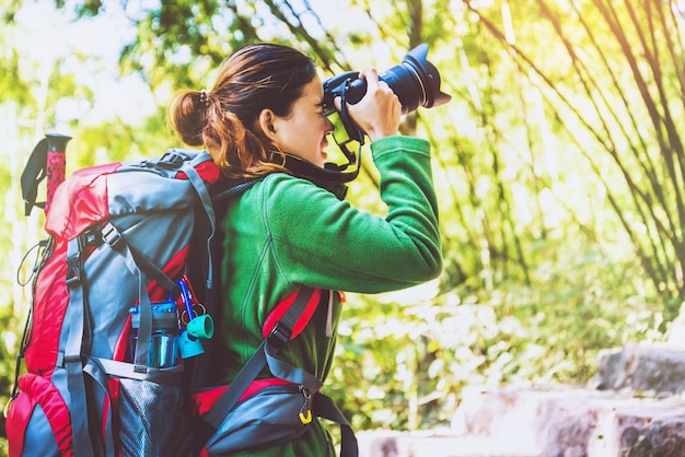 Asian woman travel nature. Travel relax. Photography tourists. Travel up the mountain