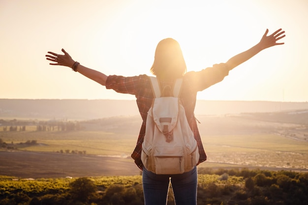 Asian woman traveler on the viewpoint over sunset time