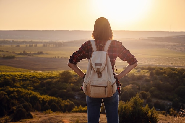 Asian woman traveler on the viewpoint over sunset time