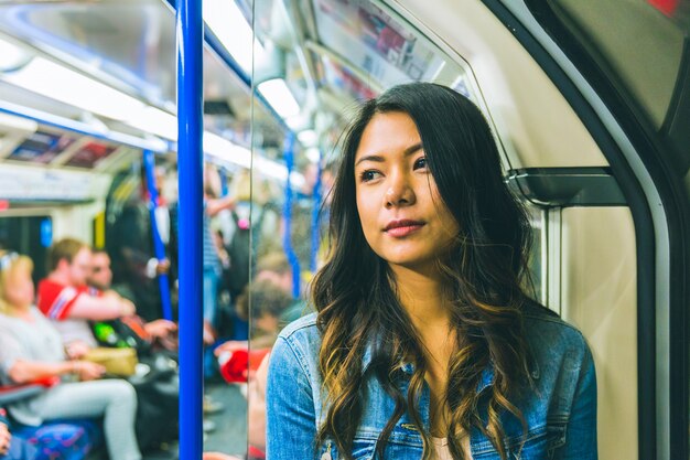 Asian woman on the tube in London