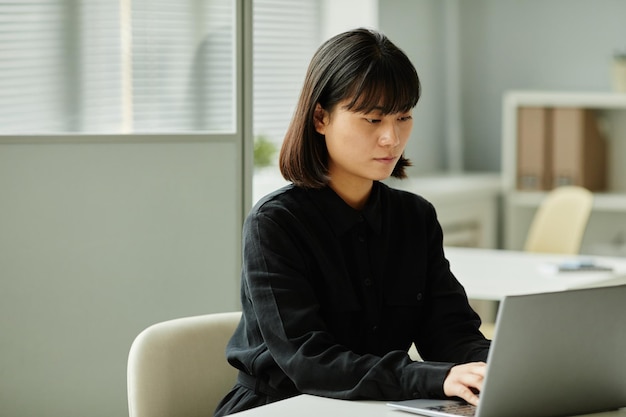 Asian Woman using Laptop