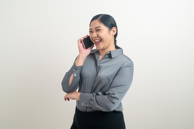 Asian woman using smartphone or mobile phone on white background