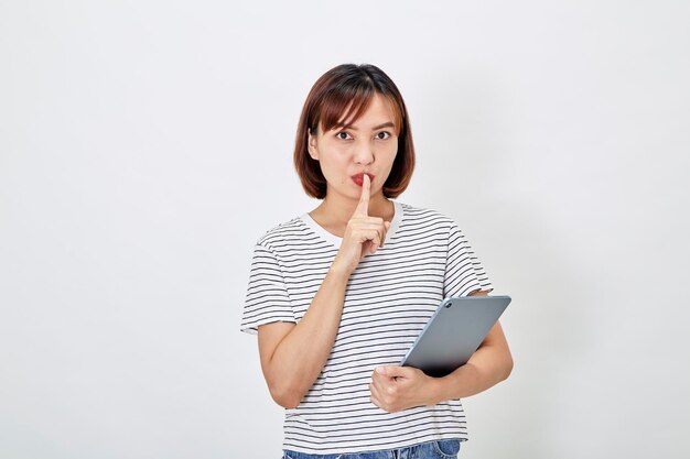 Asian woman using tablet computer on white background