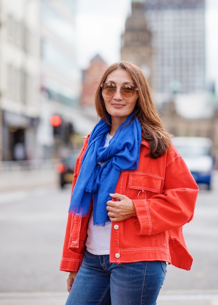 Asian woman walking around English city