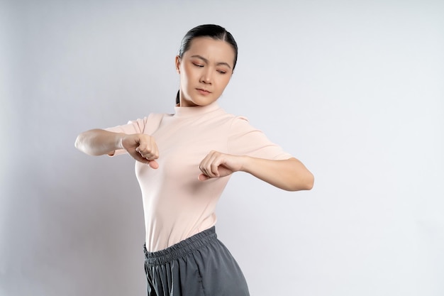 Asian woman was sick with body pain standing isolated on white background