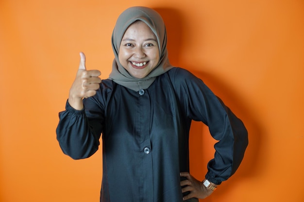 Asian woman wearing a hijab striking a pose