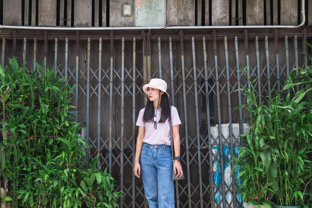 Asian woman wearing tshirt and pink hathappy and smile face of young asian woman