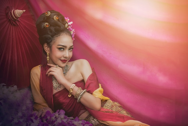 Asian woman wearing typical Thai dress, vintage original Thailand attire