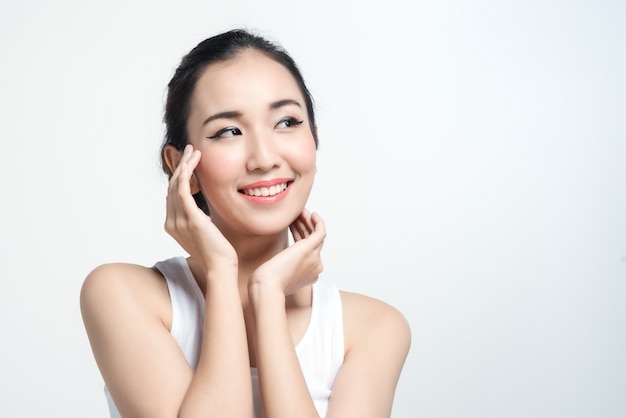 Asian woman with beautiful skinface non make up,pure cosmetic on white background