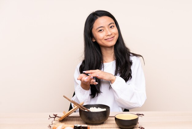 Asian woman with a bowl of noodles