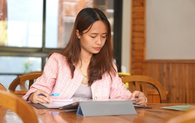 Asian woman with braces ordering food