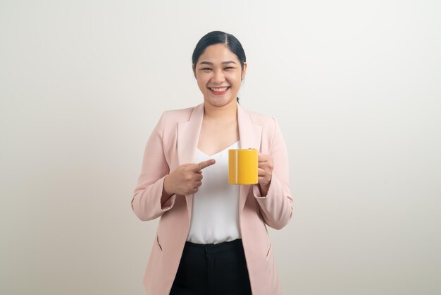 Asian woman with hand holding coffee cup on white background